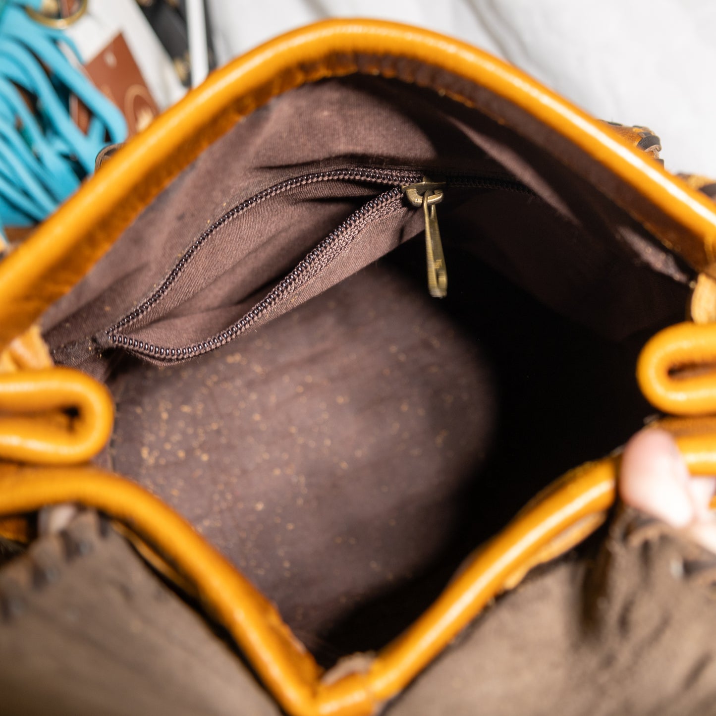 #100 BACKPAK / BRASS CLOSURE ON FRONT POCKET WITH LEATHER LACING