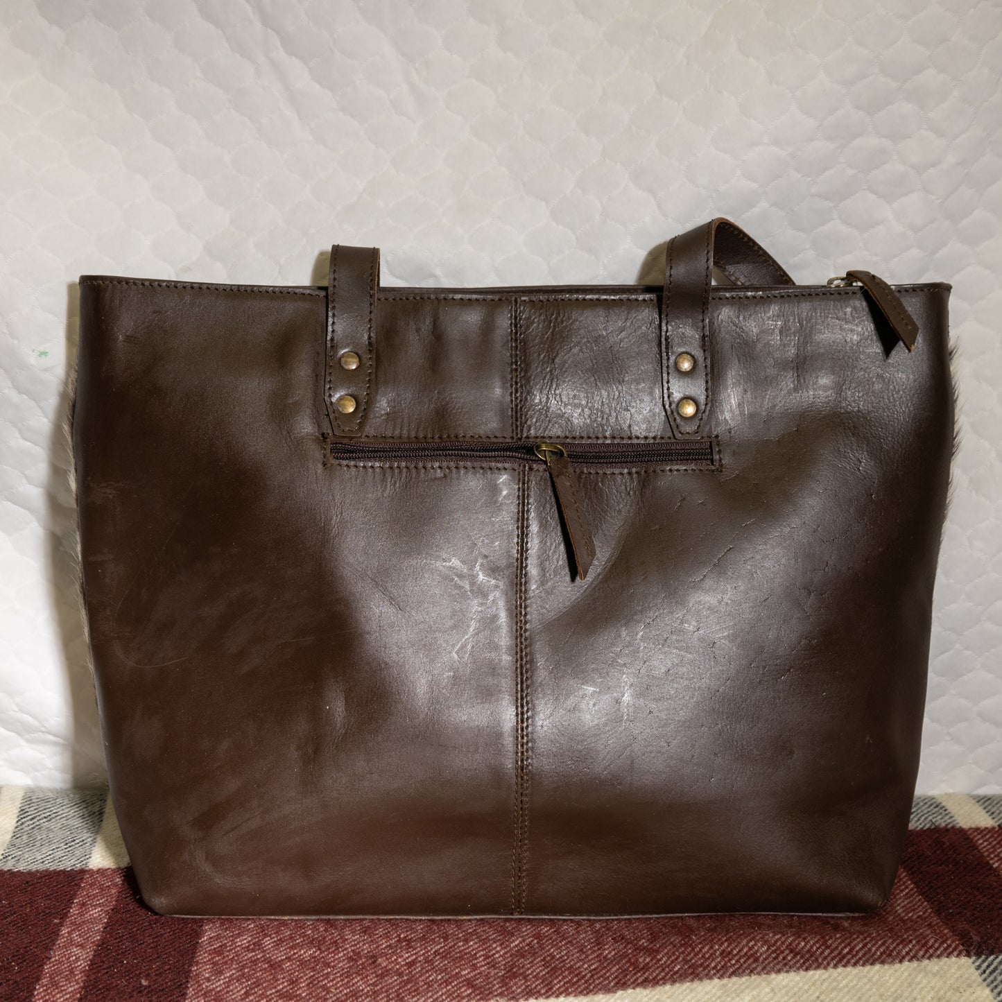 #166 LARGE COWHIDE TOTE/ TOOLED LEATHER BAND ON FRONT