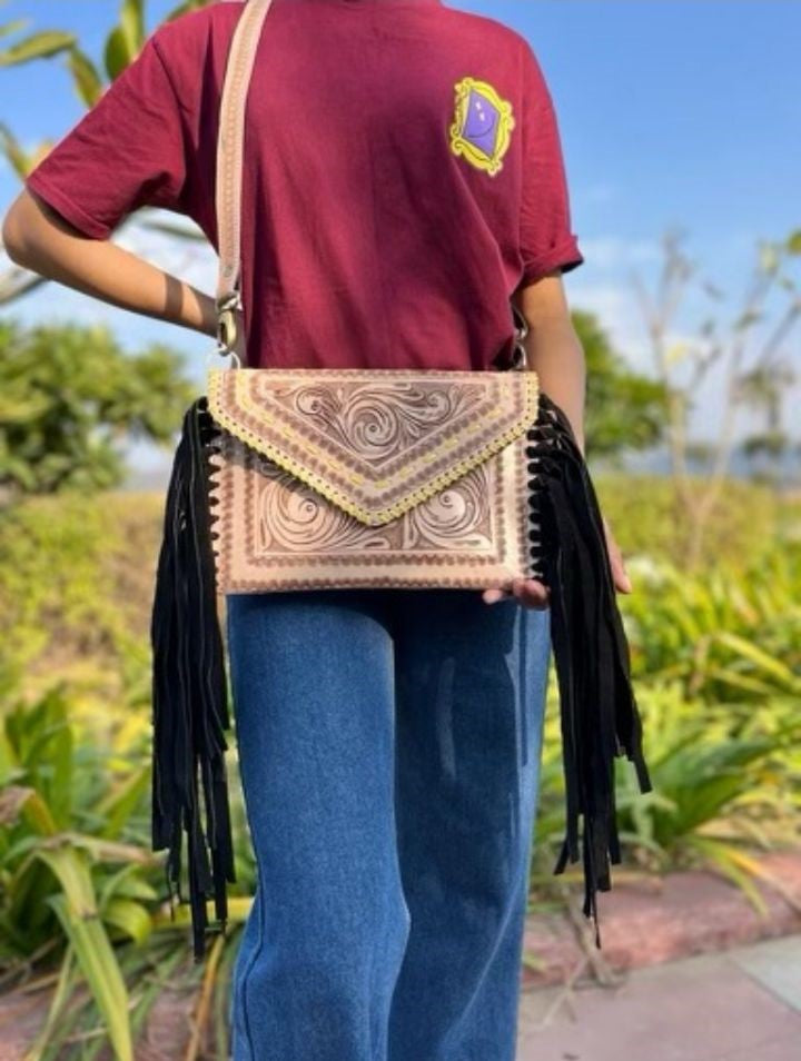 # 225 LARGE CROSS BODY ALL TOOLED LEATHER FRONT/ FRINGED SIDES