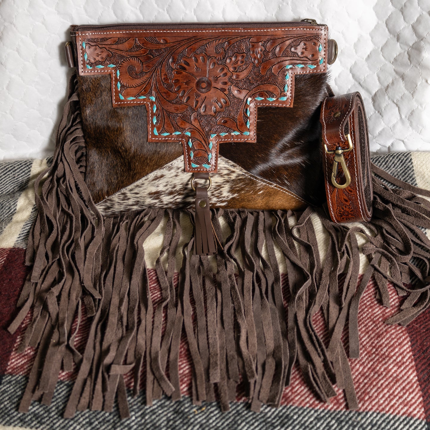 #229 CROSSBODY W/ TOOLED FLORAL PATTERN FRONT LEATHER BACK/ FRINGE AND TASSEL